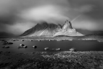 Impressive mountain of Eystrahorn in the South-East of Iceland, in a rainy day monochrome