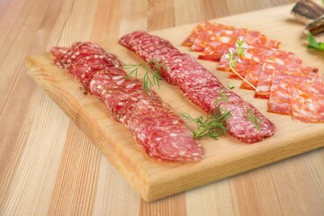 Traditional ham spiral sliced on desk with oranges and rosemary