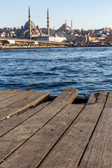 Wooden pier in old Istanbul. Boards with a background of the Bosphorus and mosques.