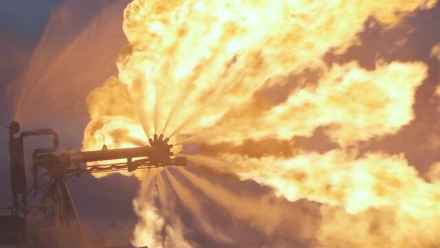 Fire. Torch on oil drilling platform. Big flame. Annealing of associated gas. Burner for burning associated petroleum gas.