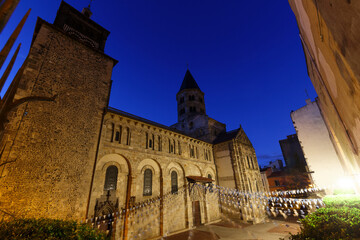 Fototapeta premium View of Romanesque church Notre Dame du Port. Church was founded by bishop of Clermont, Saint Avitus, in 6th century. Clermont Ferrand. Auvergne. France.