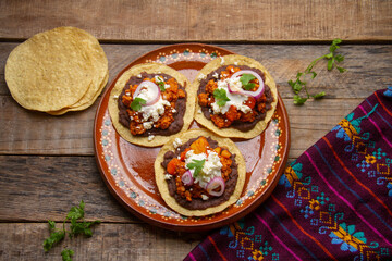 picadillo corn tostadas with cheese and beans. Mexican food
