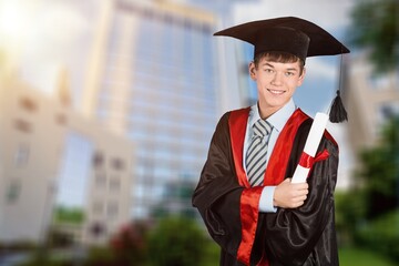 Man graduation in hat and stand on cityscape, education concept