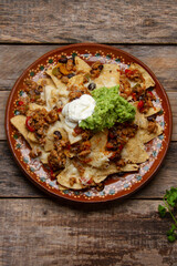 Nachos with guacamole and chilli con carne. Mexican food