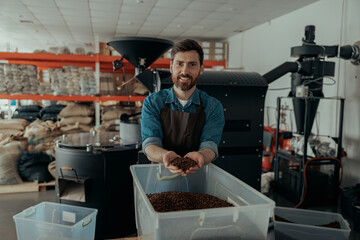 Male business owner demonstrate freshly roasted coffee beans