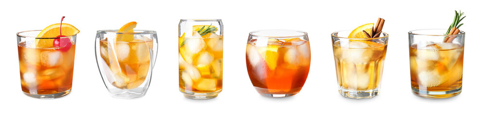Set of glasses with delicious Old Fashioned cocktail on white background