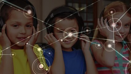 Animation of network of connections over diverse schoolchildren with headphones - Powered by Adobe