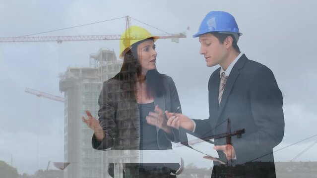 Animation of a construction site over a group of caucasian engineers