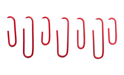 Red paper clips on white background