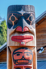 Ketchikan, Alaska, USA - July 17, 2011: Rainforest Sanctuary. Closeup, top of totem pole features...