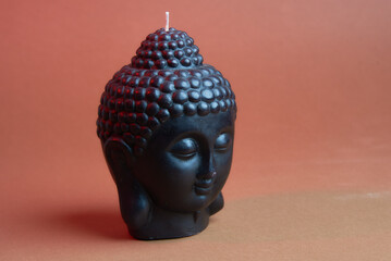 Closeup of a buddha head candle