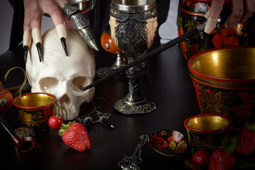 Dangerous witch preparing here dark magic with here mystical items