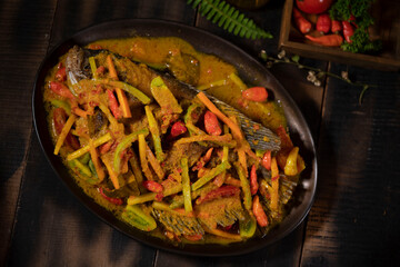 Fried Gurame Curry with Coconut Milk is a delicious seafood dish, found in Betawi cuisine, that is...