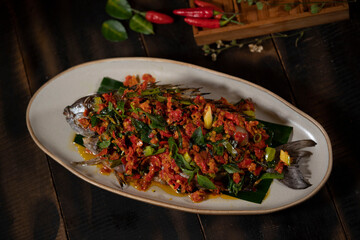 Roasted Baronang Fish with Spicy Bumbu (Rica-Rica) was a very delicious dish with combination of traditional hot and spicy bumbu (rica-rica) from Manado cuisine of North Sulawesi.