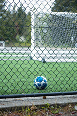 Blue and white soccer ball on sports field