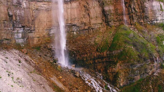 Aerial shot of a huge waterfall and high cliff. High quality 4k footage