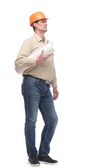 side view full length portrait of serious businessman in orange hardhat with blueprint looking forward