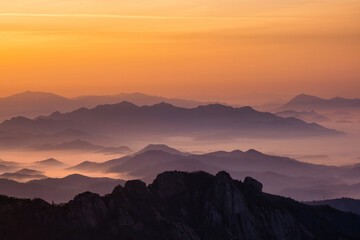 Scenic view of mountains against sky during sunrise