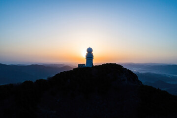 Scenic view of mountains against sky during sunrise