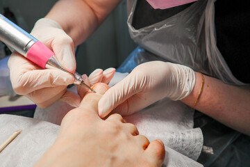 pedicure. nail file on the feet. pedicure in a beauty salon