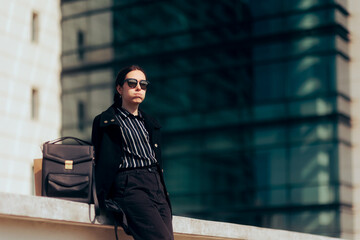 Unhappy Corporate Employee Resting Outside the Office Building