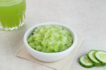 Organic cucumber pulp juice, squeezed from a slow juicer, can be used as a face mask, zero waste. Selected focus.
