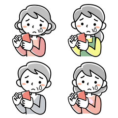 スマホを見て泣くシニア女性