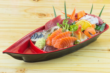 boat sashimi laid on wooden floor