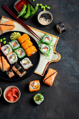 Sushi assortment on dark background.