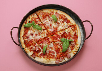 Pizza on pink background.