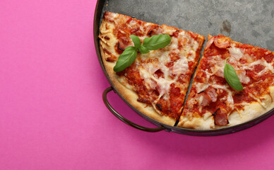 Pizza on pink background.