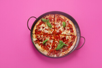 Pizza on pink background.