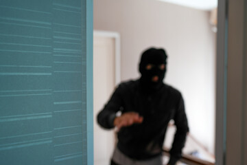 Blurry burglar In DoorWay 