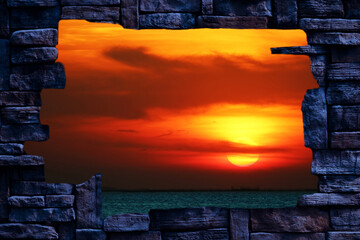 Fototapety  sunset back blur red cloud on the night sky over the horizon sea in hole stone wal