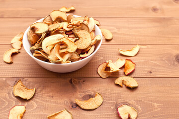 close-up of dried apples in slices on a wooden table. food products. proper nutrition. source of vitamins