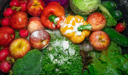 Colorful fruits and vegetables background.Assortment of organic fresh fruits and vegetables as...