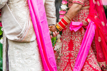 Indian married couple's holding hands close up