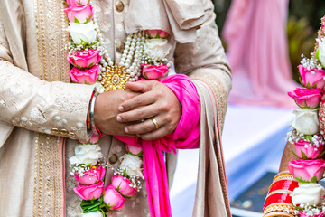 Fototapeta na wymiar Indian Hindu wedding ceremony rituals bride and groom's hands close up