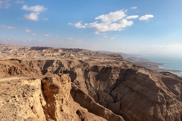 Fototapeta na wymiar Sunrise over the Dead Sea near mountains of stone desert near the Khatsatson stream, on the Israeli side of the Dead Sea, near Jerusalem in Israel