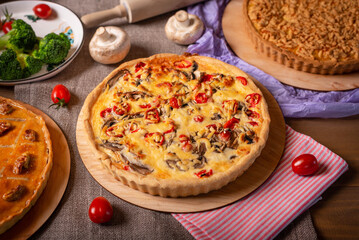 pie with mushrooms, tomatoes and cheese