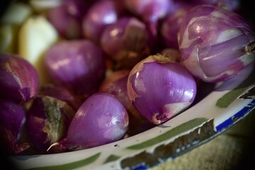 Close up of fresh peeled shallots.