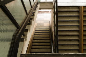Top down perspective of unkept staircase in apartment building