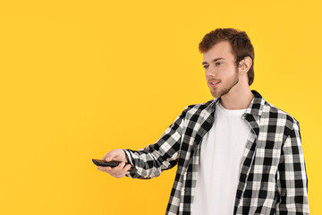 Concept of people, young man on yellow background