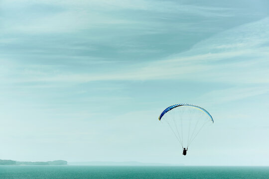 Paragliding into a beautiful sky alone