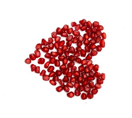 Fresh Pomegranate seeds in heart shape isolated on white background With clipping path.