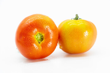 Fresh tomatoes on white background