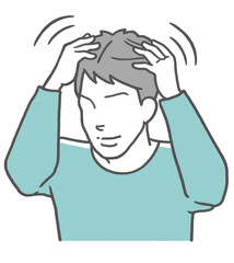 頭皮マッサージでセルフケアする男性