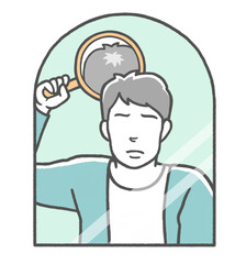 合わせ鏡をして頭頂部の薄毛に悩む若い男性