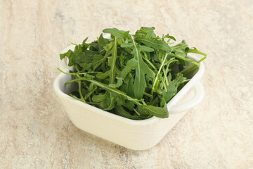 Fresh green arugula in the bowl