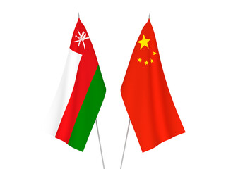 National fabric flags of China and Sultanate of Oman isolated on white background. 3d rendering illustration.